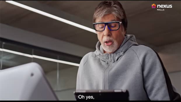 Amitabh Bachchan helps a customer pick her dress in Nexus Malls' latest ad film