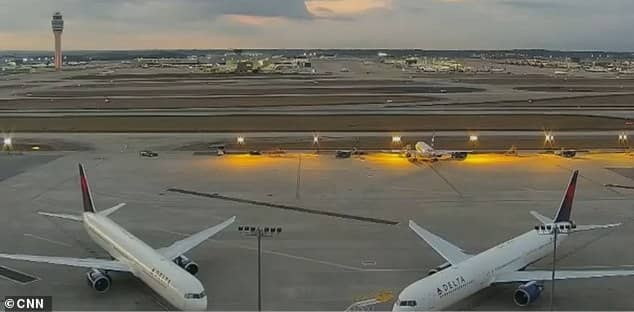 Atlanta: Two Delta planes sit on the tarmac at Atlanta's airport - the largest in the US and one of the busiest in the world - on Wednesday
