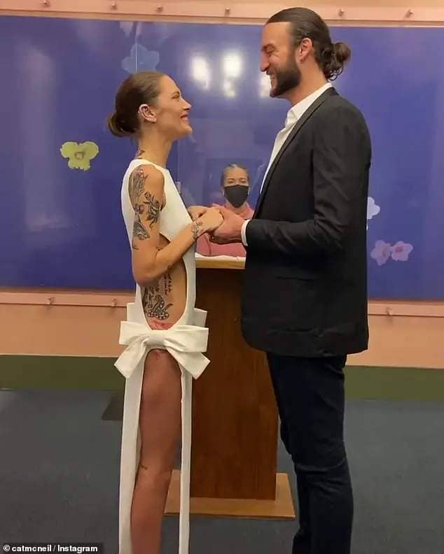 Cat made headlines when she tied the knot with American basketball player Miles in a New York courthouse on earlier this month. The 33-year-old turned heads in a $1,740 bow-detailed cut-out crepe gown by French label Mônot, which was slit all the way up both sides to reveal her extensive tattoo collection and long slender legs