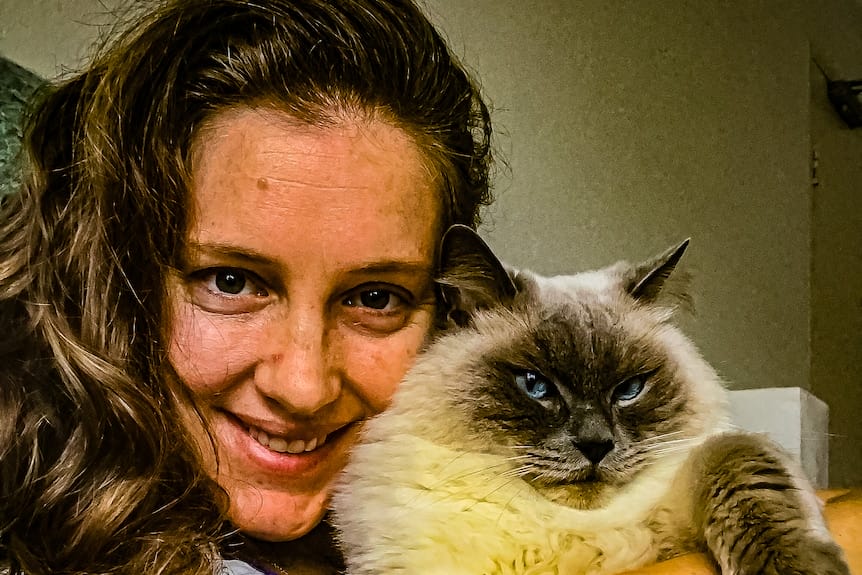 Selfie of woman with cat.
