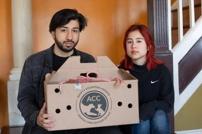 Ericka and Juan Leon pose with ACC box.