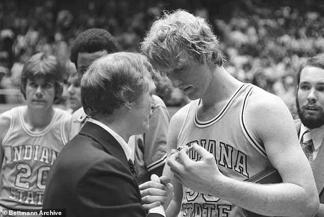Indiana State's forward, Larry Bird, gets a handshake of condolence from his coach Bill Hodges, after the Sycamore's lost to Michigan State 75-64 in the NCAA Championship game