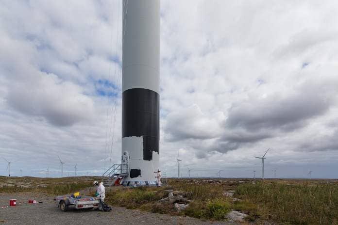 Painting wind turbines at Smøla wind farm, Norway.