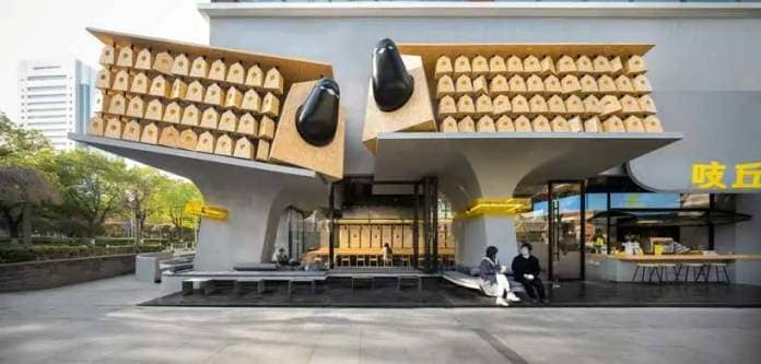 wooden nest boxes roost on exuberant columns for 'chic chic bird' noodle shop in china