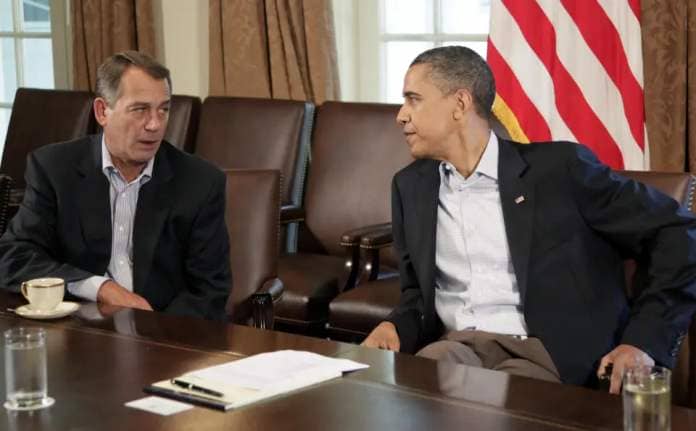 President Barack Obama consults with House Speaker John Boehner of Ohio, left, in the Cabinet Room of the White House, Saturday, July 23, 2011, in Washington, to talk about the financial obligation. (AP Photo/Carolyn Kaster)
