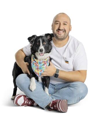 PetSmart associate and their dog display a bandana from the You Are Loved collection, created in partnership with PetSmart&#x002019;s PRIDE AT WORK associate resource group