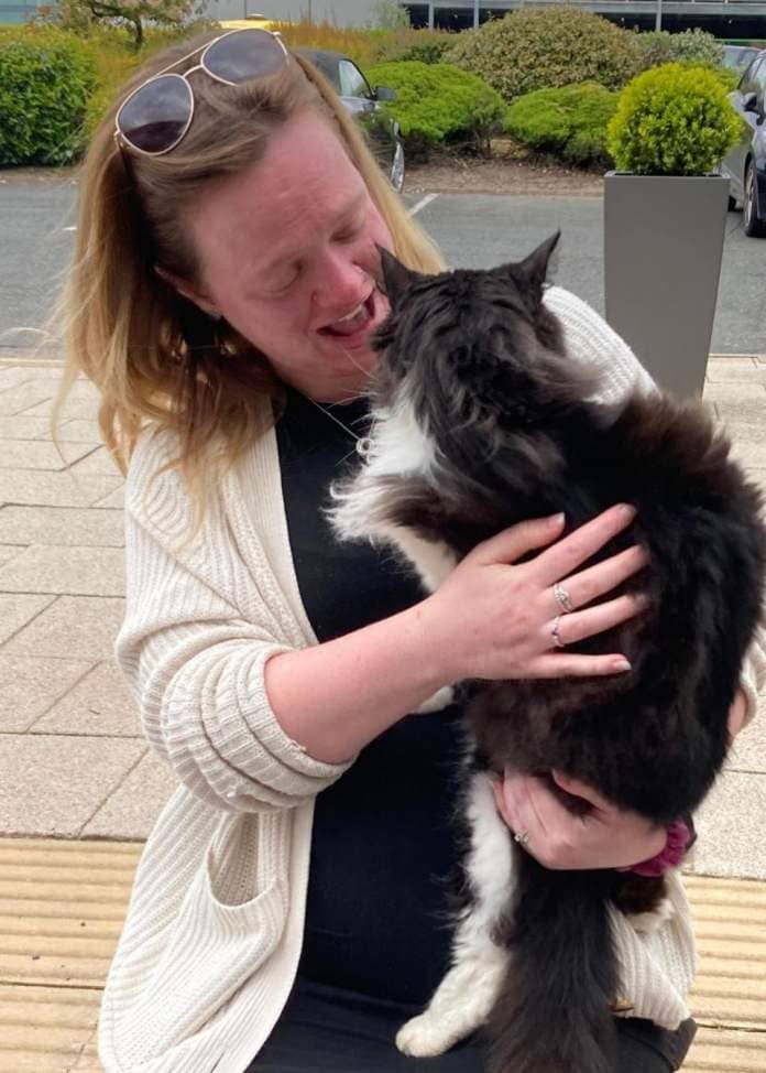 The Northern Echo: Sammy reunited with his owner, Sian. Picture: Cats Protection 