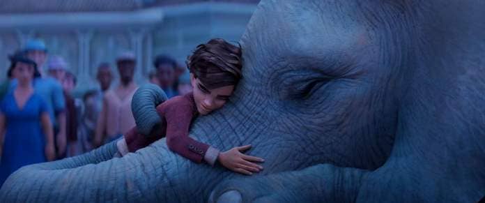 peter hugs an elephant in a scene from the magician&#39;s elephant, a good housekeeping pick for best kids movies 2023