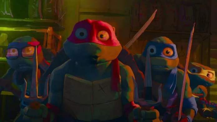 the ninja turtles look frightened in a scene from teenage mutant ninja turtles mutant mayhem, a good housekeeping pick for best kids&#39; movies 2023