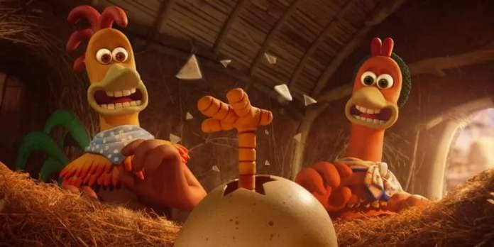 a leg bursts through an egg in a scene from chicken run dawn of the nugget, a good housekeeping pick for best kids movies 2023