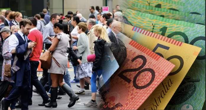 A composite picture of a crowd of individuals walking on the street and Australian currency to represent money Aussies will return from insurance companies.