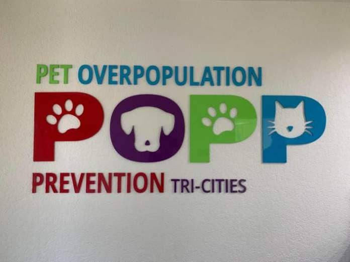 Logo sign inside the Pet OverPopulation Prevention Clinic in Pasco.
