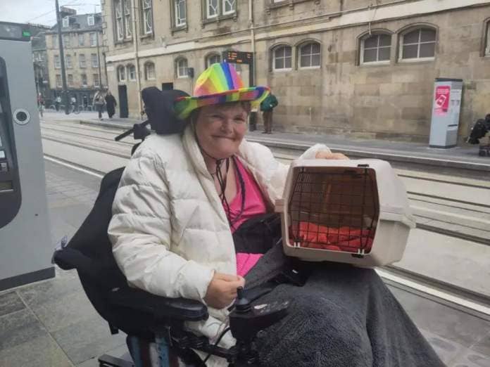 HeraldScotland: Jessie Csere with her kitten, about to get on tram