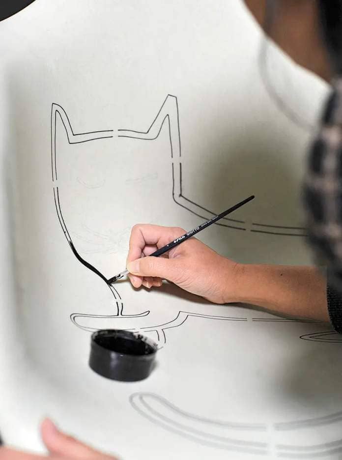 VITRA releases limited edition of eames' iconic fiberglass armchair with steinberg cat