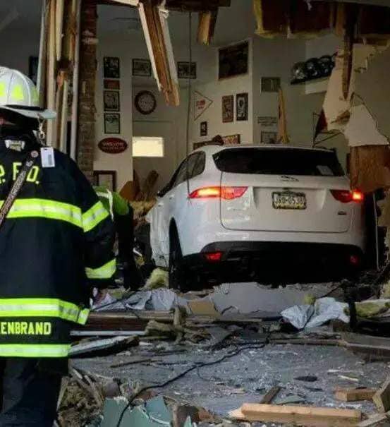 A Jaguar crashed into the Sports Page barbershop on William Street, Pittston, on Oct. 15, 2022, in what Pittston police allege was a road rage incident between two drivers.
                                 Times Leader file photo