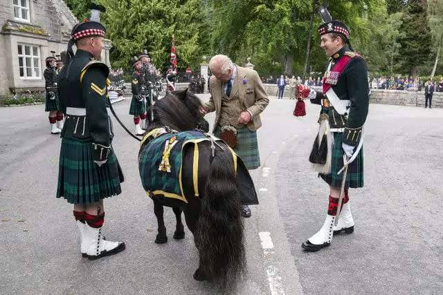 <p>Jane Barlow/PA Images via Getty</p> King Charles meets the Royal Regiment of Scotland mascot Shetland pony Corporal Cruachan IV at the gates of Balmoral on Aug. 21.
