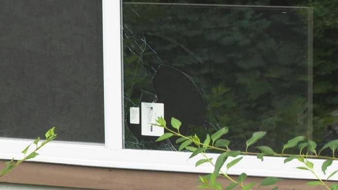 Broken window that was allegedly smashed by vandals at a Woonsocket cart shelter. (WJAR){p}{/p}