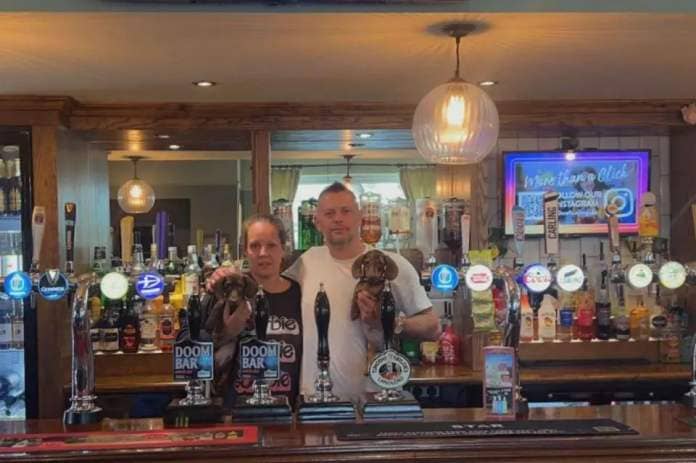 Sarah and Aaron Bruce - new landlords of The Star pub in Crawley Road, Roffey - with Dachsund pups Ronnie and Reggie. Photo contributed (Photo: Contributed)