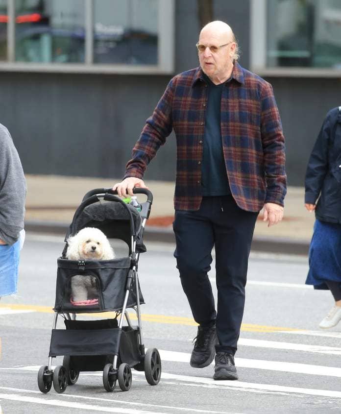 Hated billionaire Man Utd owner Avram Glazer was seen pushing his dog in a pram around New York in this bizarre photo