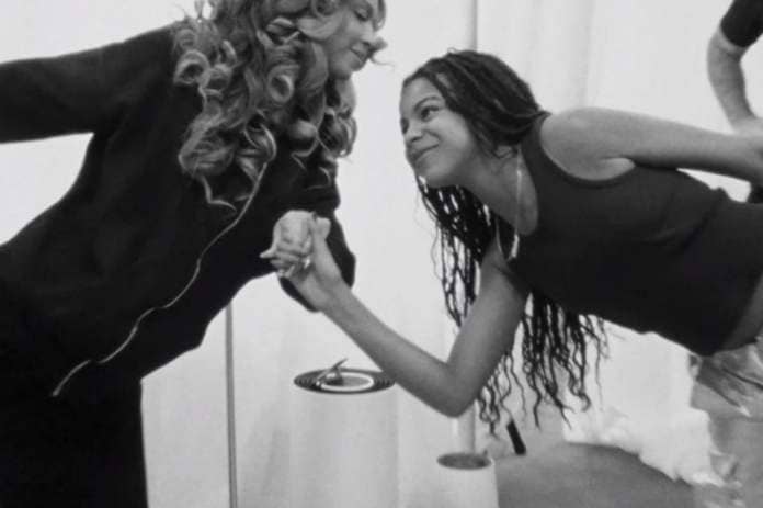 Beyoncé and Blue Ivy, who joined her mum on stage during the tour, stretching (Renaissance: A Film By Beyoncé)
