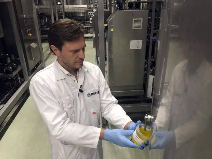 Kees Aarts, CEO of Dutch insect farming company Protix, pours oil made from black soldier fly larvae at the company's facility in the Netherlands. 