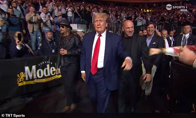The former president was flanked by UFC chief Dana White and Tucker Carlson in New York