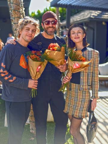 <p>Courtesy of Ollie</p> Lukas Gage, Zachary Quinto, and Dylan Mulvaney at Max Greenfield's Furry Friendsgiving