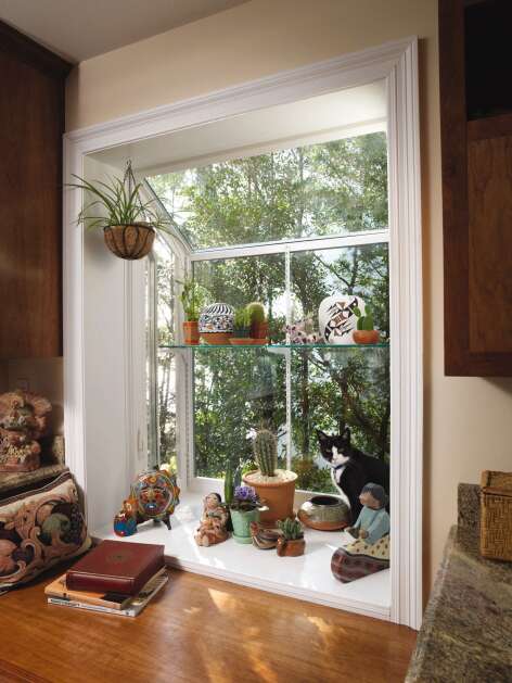 Simonton Windows A large garden window can accommodate many plants, decorative items and your cat.