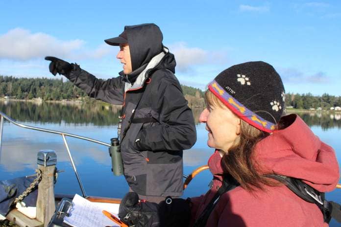Alex Bruell photo
Cara Borre, left, calls out bird names and counts to Asta Tobiassen, right, who photographs and records the bird numbers on New Year’s Eve day in Quartermaster Harbor.
