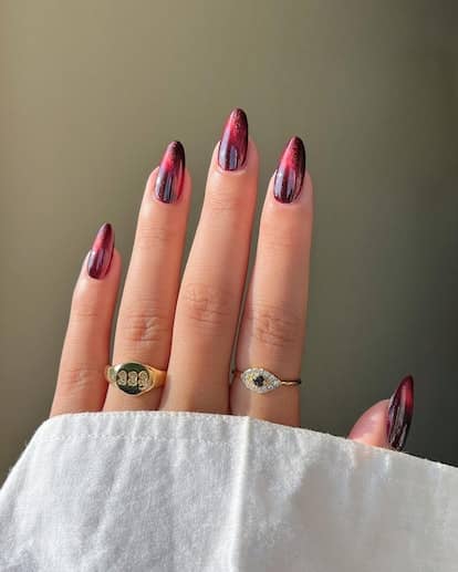 Try a dark red cat eye nails for a sultry wintertime manicure.
