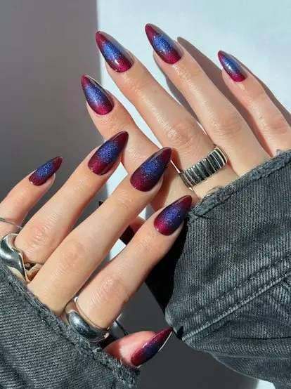 This glittering aura manicure is a unique take on the cat eye nail art trend.