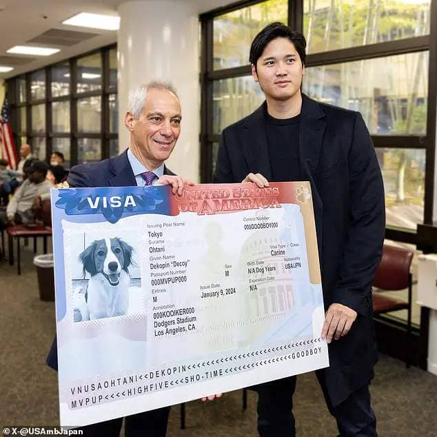Shohei Ohtani is presented the special 'visa' by US Ambassador to Japan Rahm Emanuel