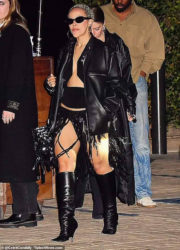 The Need To Know singer, 28, wore a very short black skirt made entirely of fringe with slits in the front over her legs that went nearly all the way to the waistline of the skirt