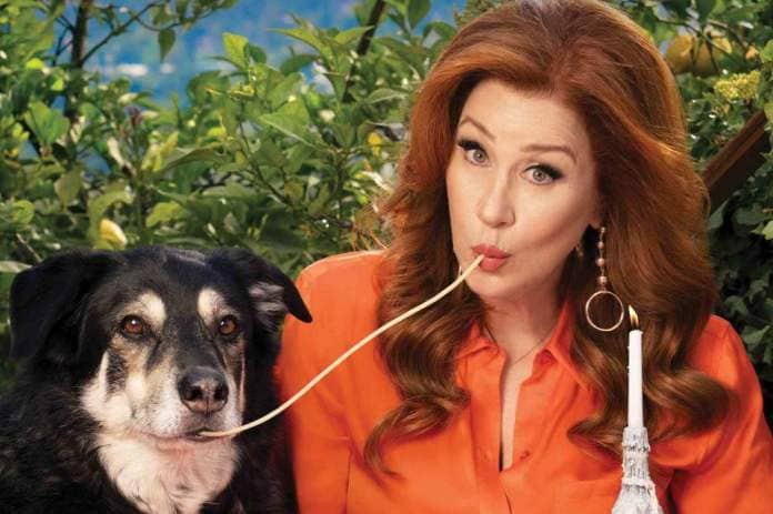 <p>Elisabeth Caren for PETA</p> Lisa Ann Walter poses with her dog Buster for a PETA adoption campaign