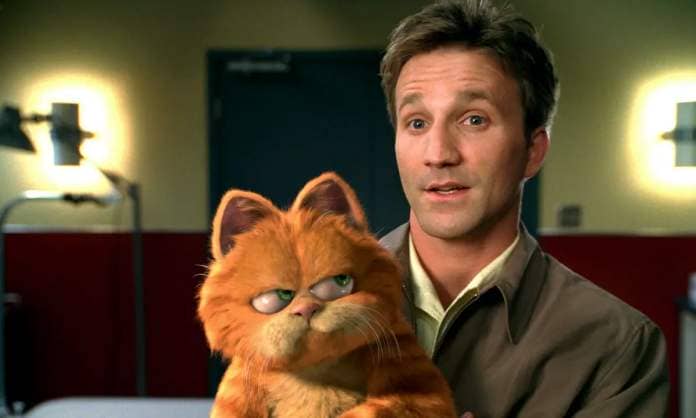 Garfield the orange CG cat looks up at his owner Jon (Breckin Meyer) with a disdainful lip-curl in Garfield: The Movie