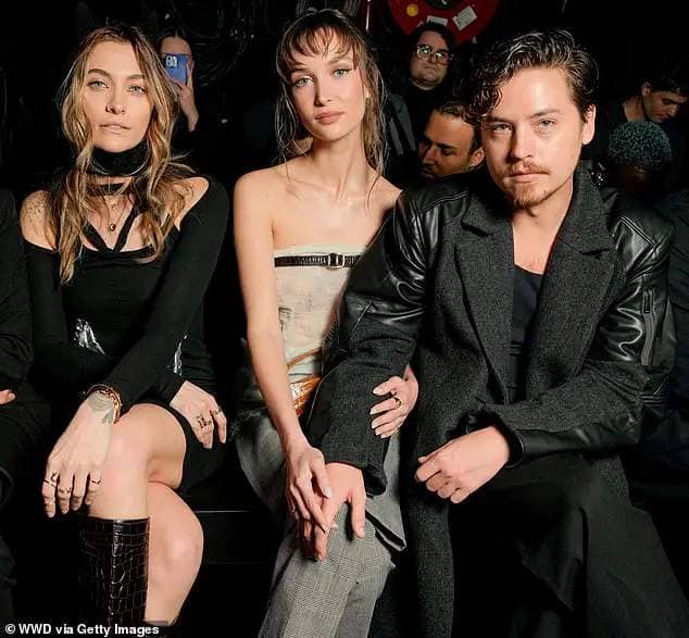 Cole Sprouse, 31, (R) and his gorgeous Ari Fournier (M) also made an arrival at the designer fashion show - pictured with Paris (L)