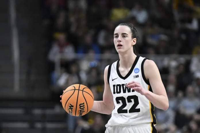 Iowa guard Caitlin Clark (22) brings the ball up court against Colorado during the fourth quarter of a Sweet Sixteen round college basketball game during the NCAA Tournament, Saturday, March 30, 2024, in Albany, N.Y. (AP Photo/Hans Pennink)