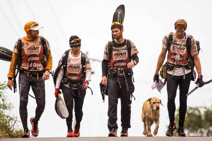 A photo of Mikael Lindnord and his teammates, including Arthur the dog.
