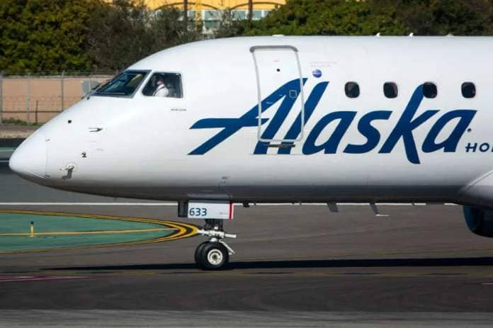 <p>Kevin Carter/Getty </p> An Alaska Airlines plane