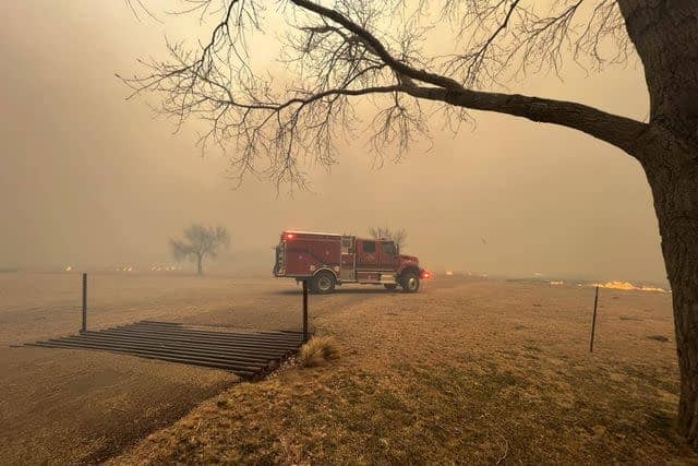 <p>Greenville Firefighter Association/ Handout /Anadolu via Getty Images</p> A fire truck driving towards the Smokehouse Creek fire