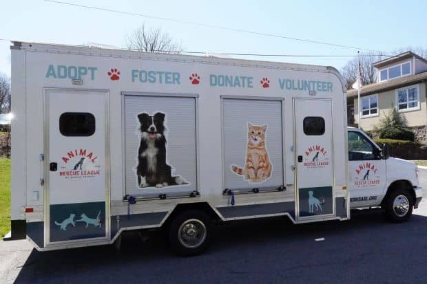 The entrance side of the Animal Rescue League of Berks County's new mobile adoption and clinic vehicle, a custom-outfitted Ford E350 with graphic wrap by Dark Side Vinyl Graphix & Signs in Spring Township. (Jose Joel Delgado-Rivera - Animal Rescue League of Berks County)