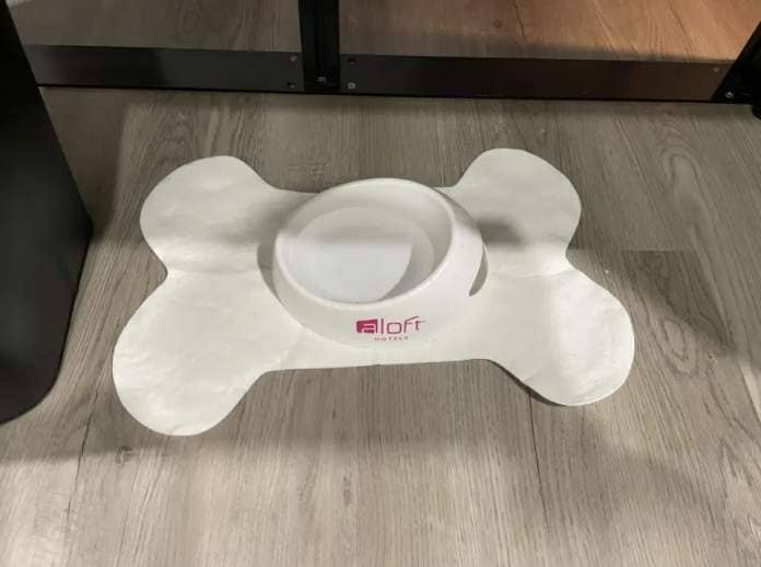 A pet bowl shaped like a bone with 