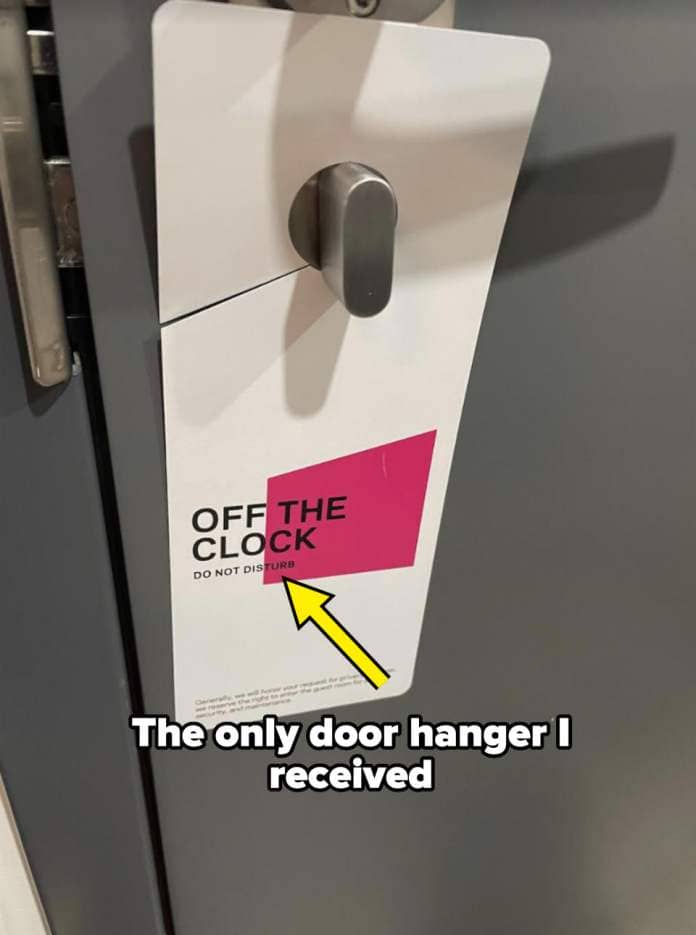 Door hanger on a handle reads 'OFF THE CLOCK' indicating 'Do Not Disturb' at a travel accommodation