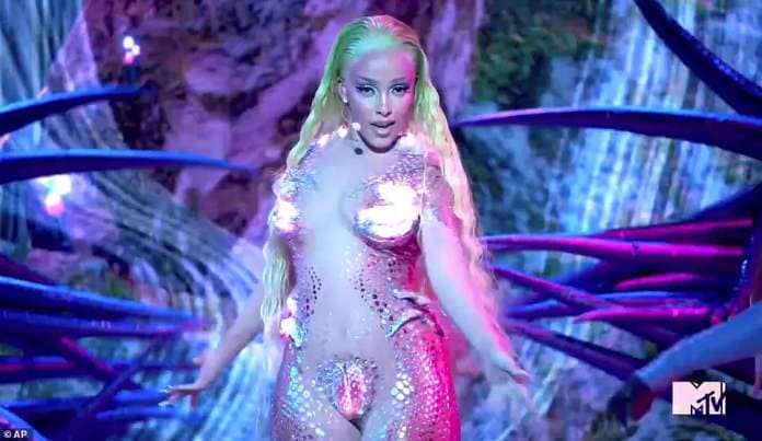 Racy: Back in 2020, Doja appeared almost nude in an iridescent bodysuit for her MTV VMAs performance