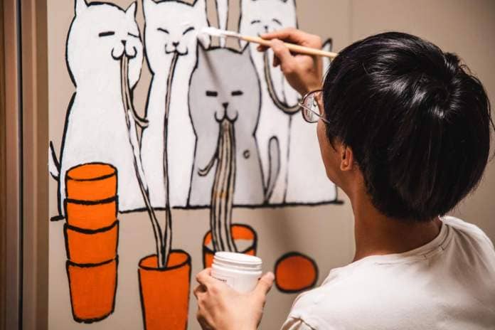 https://www.gettyimages.co.uk/detail/photo/young-man-draws-cats-on-the-walls-as-home-royalty-free-image/1175457005
