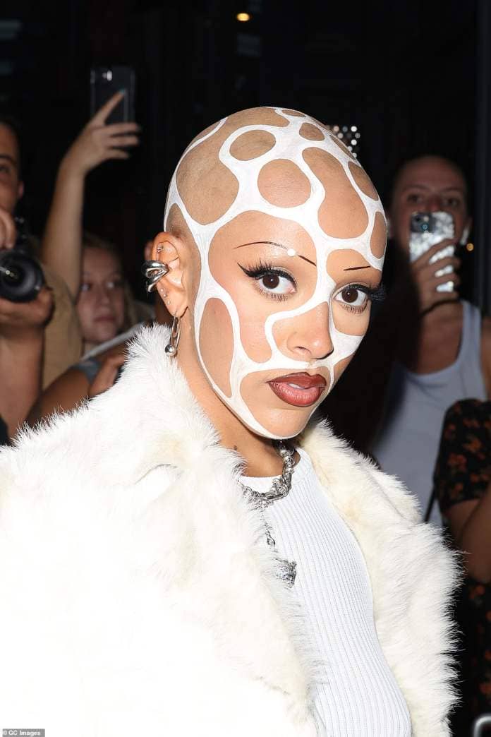She opted for unique face paint that covered her whole face and had freshly shaved head with undulating white lines all over her scalp for maximum impact