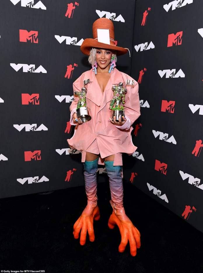 Doja made sure to ruffle some feather while hosting the 2021 MTV Video Music Awards for the first time (pictured wearing boots that resembled chicken claws during the ceremony)