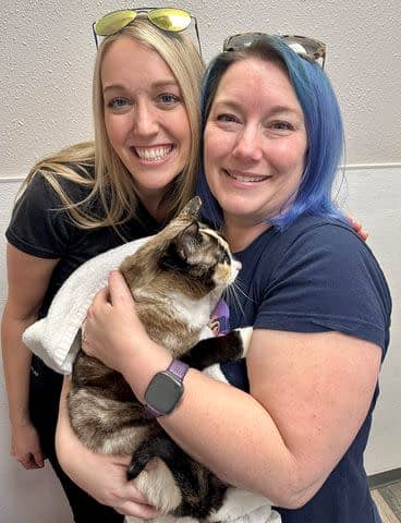 <p>Courtesy of Carrie Stevens Clark</p> Carrie Clark (left) with Brandy, the Amazon employee that helped reunite Carrie with her cat