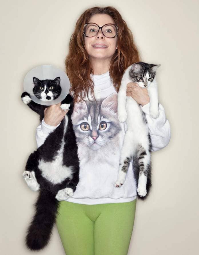 https://www.gettyimages.co.uk/detail/photo/woman-holding-two-cats-royalty-free-image/150654728