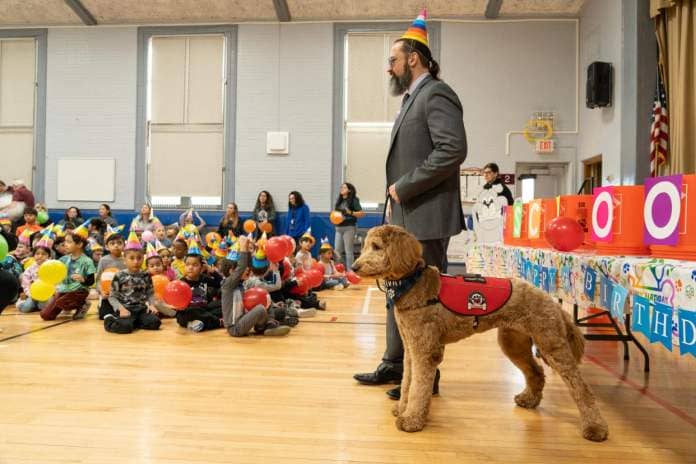 Clifton school district therapy dog, Chewie, celebrates his one year birthday at School 9 in Clifton, NJ on Monday Jan. 22, 2024. Mark Gengaro, assistant superintendent, paraded Chewie around the gymnasium for his celebration.